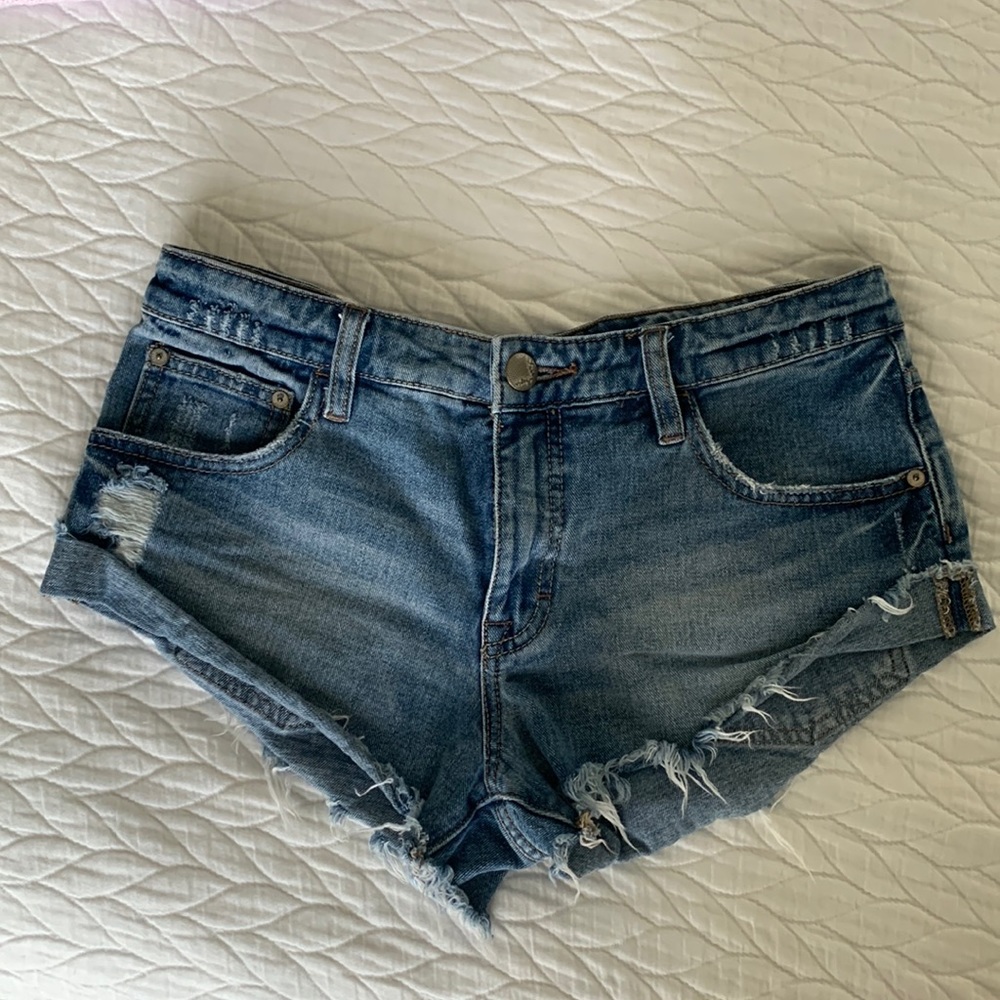 Free people. Size 25. Low rise jean shorts. Runs large